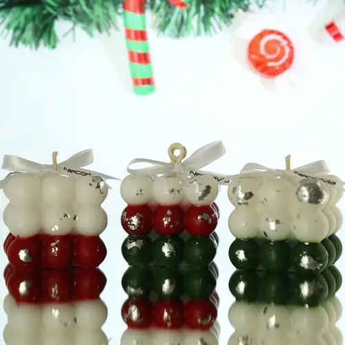 Christmas-themed decorative bubble candles in red, white, and green with silver leaf accents and ribbon bows.