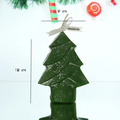 Green Christmas tree-shaped candle with silver accents and a white ribbon bow.