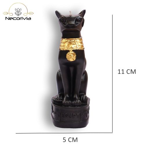 Black Bastet candle with gold accents on a pedestal