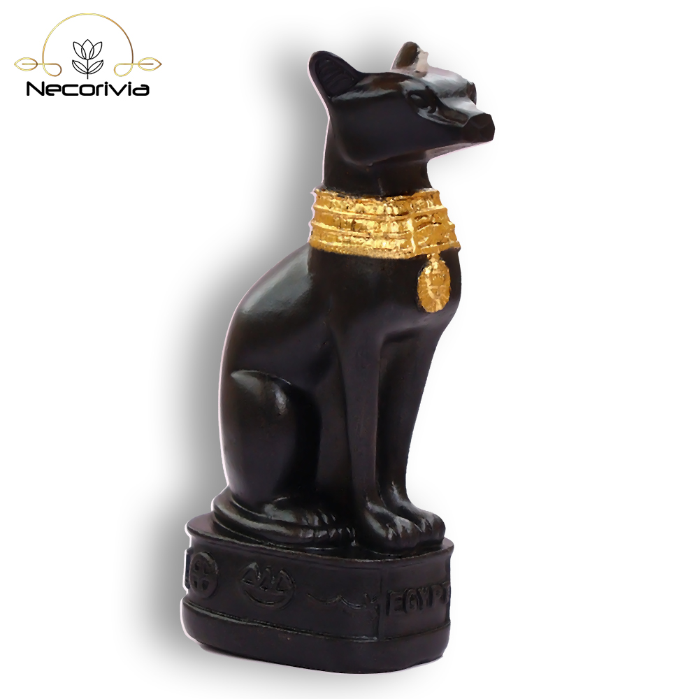 Black Bastet candle with gold accents on a pedestal