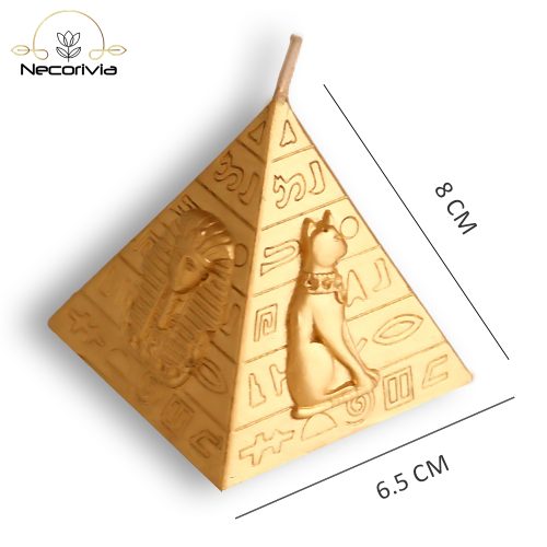 Gold pyramid-shaped candle with ancient Egyptian hieroglyphic designs.