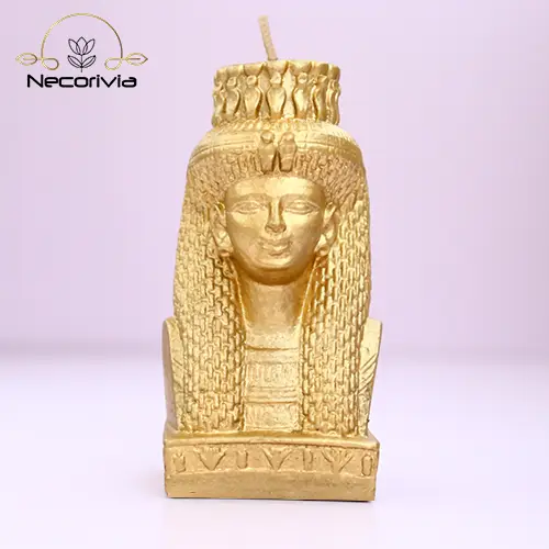 Gold candle bust of Meritamen, featuring detailed Egyptian design elements.