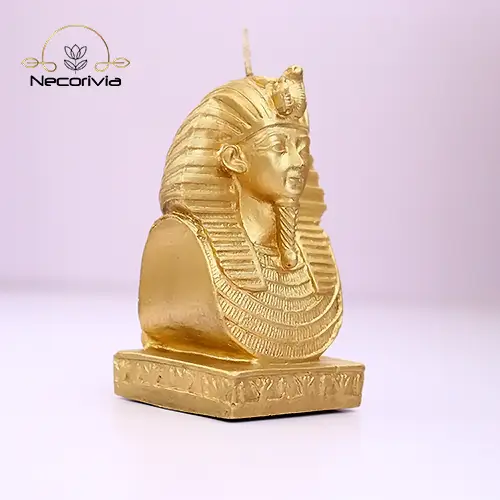 Gold candle bust of Tutankhamun featuring detailed ancient Egyptian craftsmanship.