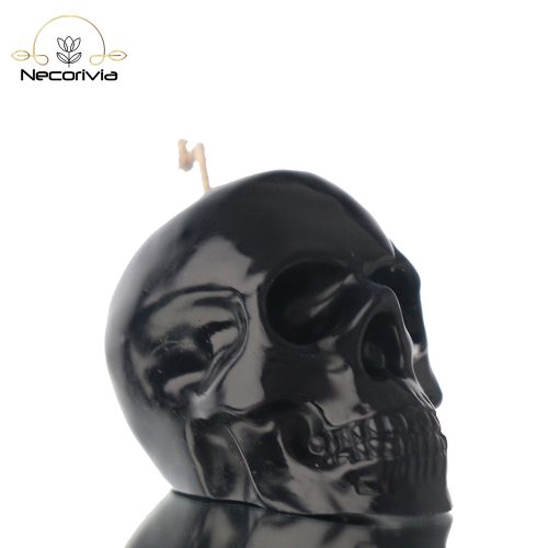 Black skull-shaped candle with a single wick.